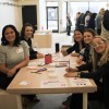 10 Kate Denman writes notes with other volunteers