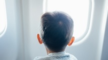 Little boy looks out airplane window by Hanson Lu NoRgwe0jKi8 Unsplash